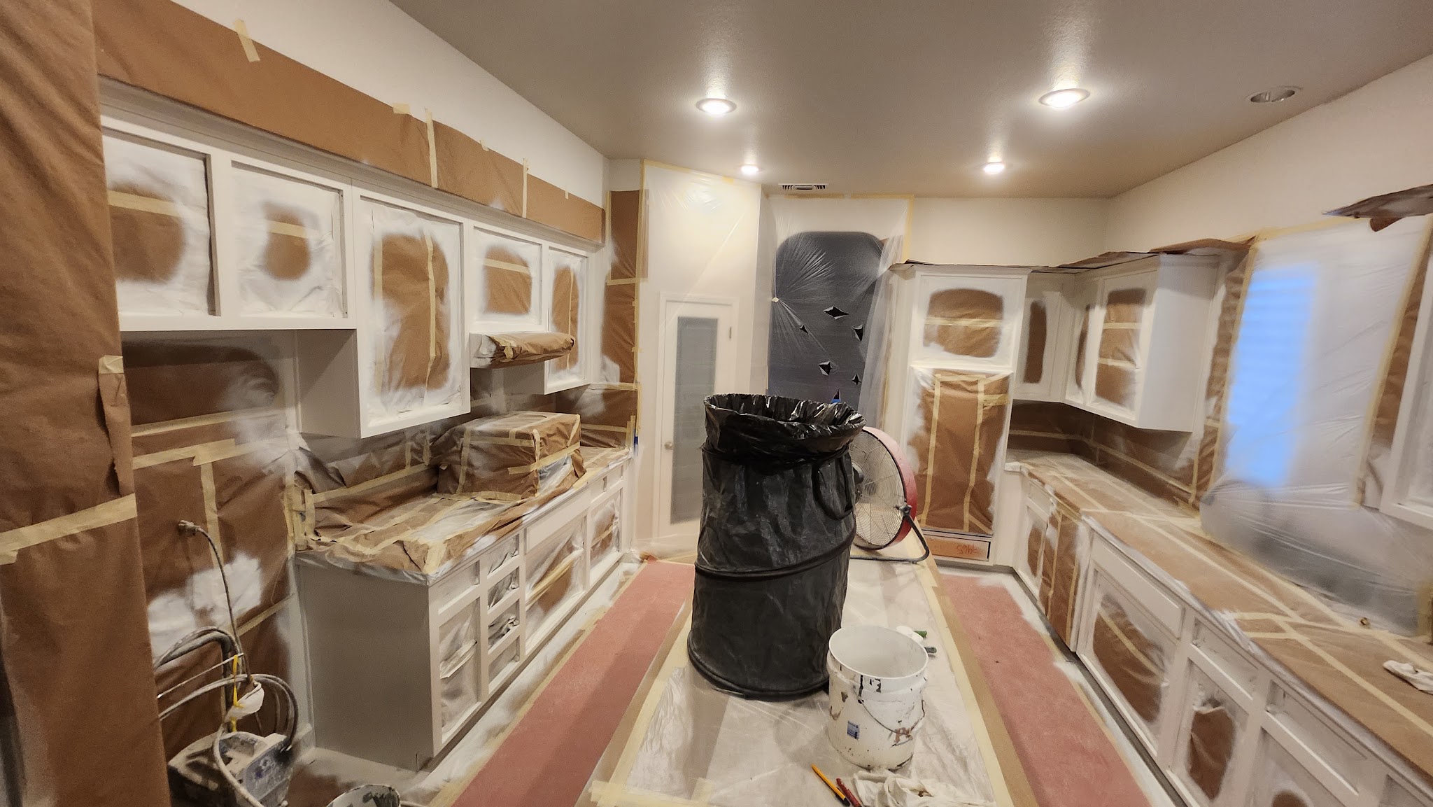 Kitchen fully masked and prepped for a repaint